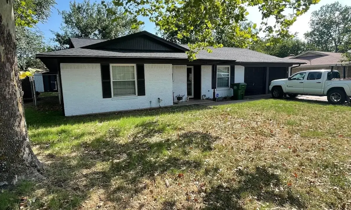 Professional roofing crew working on a residential roof in Sellersburg